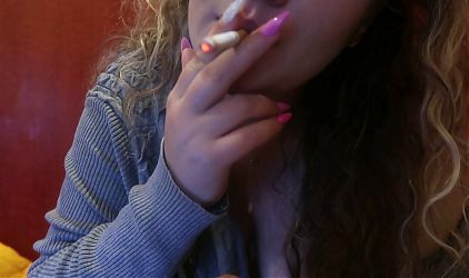girl blowjob a dildo while smoke a cigarrete